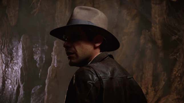 A screenshot shows Indy in a cave. 