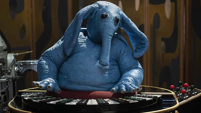 An image shows Max Rebo at his keyboard. 